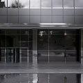 Modern Retail Storefront Design With Glass Door Wooden Signage and Contemporary Facade Details