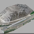 Aerial View Of Natural Mountainous Terrain With Winding Road Rock Formations And Green Vegetation