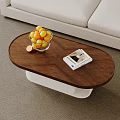 Modern Coffee Table With Oranges Book And Pillows In Living Room With Abstract Painting