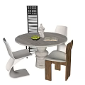 Round Marble Dining Table With Modern White And Wooden Chairs And Fruit Bowl