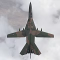 Military Camouflage Fighter Jet Flying Through Clouds With Weapon Pylons