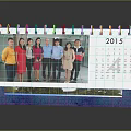 2015 Desk Calendar With Group Photo Of People And Green Landscape Design