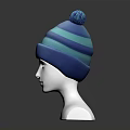 Blue Striped Knit Hat With Pom Pom Displayed On Mannequin Head