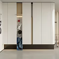 Modern Entryway Interior Design With White Storage Cabinets Decorative Sculptures And Recessed Lighting