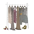 Stylish Layered Dresses In Various Colors On White Clothing Rack With Shoes