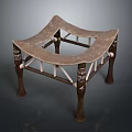Traditional Wooden Stool Featuring Curved Seat Carved Legs And Crossed Support Structure