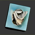 Decorative Teal Colored Rosto Brand Tissue Box with Tissue Sticking Out