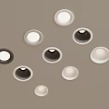 Round Recessed Ceiling Lights In Various Sizes And Colors On Gray Background 3d model