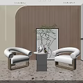 Modern Lounge Area Featuring White Armchairs Small Coffee Table Green Plant And Wooden Accent Wall