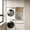 Modern Stackable Washing Machines In Bright Laundry Room With White Cabinets And Sink Area