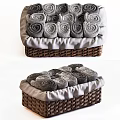 Soft Gray Rolled Towels in Wicker Storage Baskets for Daily Household Use