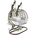 Wicker Hanging Chair With Cushions Blanket And Ivy Plants
