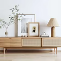 Natural Wood TV Stand with Rattan Drawers Green Plant Vase Framed Art and Linen Shade Lamp