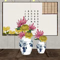 Blue and white porcelain vases with red yellow flowers on wooden table and calligraphy painting