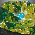 Mountainous Natural Garden Landscape With Rolling Green Terrain And Blue Water Features