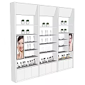 White Multi Tiered Display Shelves With Cosmetic Products And Advertising Panels