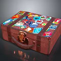Vintage Brown Suitcase Decorated With Colorful Travel Stickers And Leather Handle