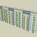 Modern Residential Apartment Building With Yellow And Gray Exterior Multiple Windows And Balconies