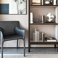Modern Wooden Bookcase With Books Decorative Sculpture And Bamboo Painting Near Black Leather Chair