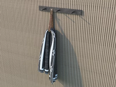 Black and White Striped Towel Hanging on Black Rod Against Brown Textured Wall 3d model