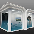 Modern Exhibition Booth With White Exterior Glass Walls Interior Tables Chairs And Decor