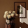 White Hydrangeas In Decorative Vase On Small Table With Framed Wall Art And Sunlight Shadows