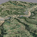 Aerial View Of Mountainous Terrain With Winding River And Green Valleys