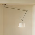 Modern Adjustable Pendant Light With White Fabric Shade And Metal Arm In Minimalist Interior Space