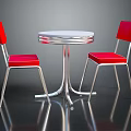 Elegant Round Silver Table And Two Red Chairs With Metal Frame In Reflective Surface