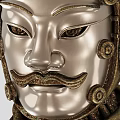 Intricately Carved Metallic Head Sculpture With Stern Facial Features Neck Adornments And Ornamental Details