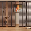 Black Louvered Shutters As Interior Room Divider With Wooden Floor And Plant