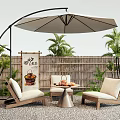 Outdoor Living Space Table With Patio Umbrella Chairs Bamboo Fence And Green Plants