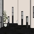 Modern Outdoor Lights With Sleek Post And Wall Designs Featuring Warm Glow And Green Plants