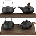 Black Cast Iron Teapots Placed On Wooden Tray For Traditional Tea Sets