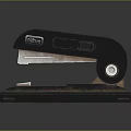 Black Stapler With Metal Body And Desktop Base For Office Use 3d model