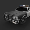 Classic Black And White Police Car With Light Bar On Roof And Police Badge