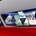 Modern Exhibition Display Board With Triangular Panels Colorful Images And Informative Content On Red Surface 3d model