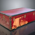 Vintage Red Trunk With 21 And THOMWELLS Engraving Worn Edges Black Trim And Glossy Surface