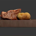 Roasted Pork Ribs and Golden Potato with Fresh Green Garnish on Wooden Board