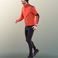 Man Wearing Orange Sporty Top And Black Pants Walking With Wristwatch In Active Pose