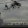 Helicopter Taking Off From Ship Deck With Ground Crew And Overcast Sky