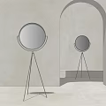 Round Floor Mirror With Tripod Metal Stand In Minimalist Interior Design