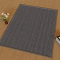 Square Gray Striped Rug On Wooden Floor With Vase And Small Radio