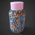 Transparent Plastic Bottle With Pink Cap Holding Blue And Orange Capsules For Daily Use