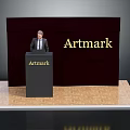Artmark Presentation Podium With Person Standing Behind Dark Backdrop And Wooden Floor