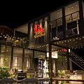 Modern Container Building Cafe Design With Outdoor Terrace Tables Chairs And Lighting