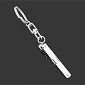 Elegant Silver Metallic Pistol Shaped Jewelry Keychain on Black Surface with Shiny Reflection