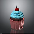 Blue Frosting Cupcake With Pink Liner And Red Cherry On Reflective Surface
