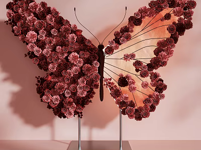 Butterfly Shaped Art Installation With Deep Red Flowers And Metal Stands 3d model