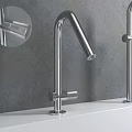 Sleek Modern Stainless Steel Faucets With Different Heights On White Countertop Grey Wall